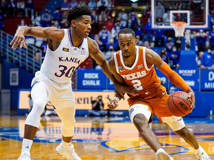 Texas' Matt Coleman drives vs. Kansas